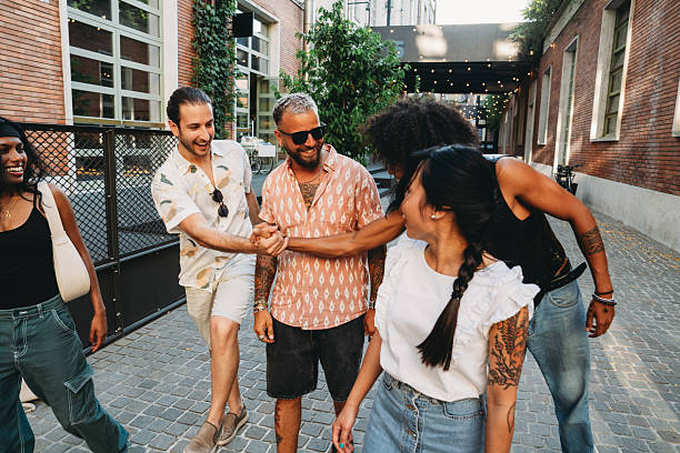 istock Group of Young Adults Enjoying Urban Stroll 2224783597