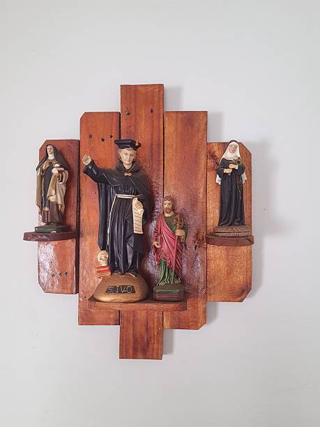 Small religious altar with images on the wall.