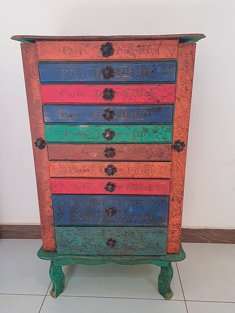 Antique wooden cabinet with colorful drawers.
