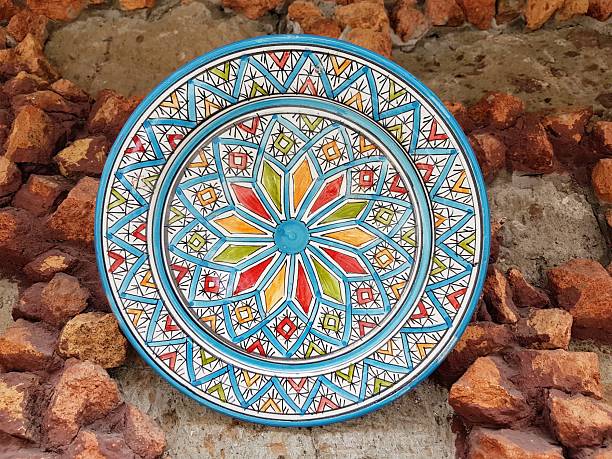 istock Beautiful hand-painted traditional ceramic plate from Spain on a stone wall 2224791663