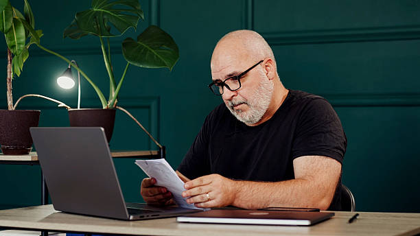 istock Businessman in a modern office working on a laptop. 2224791875