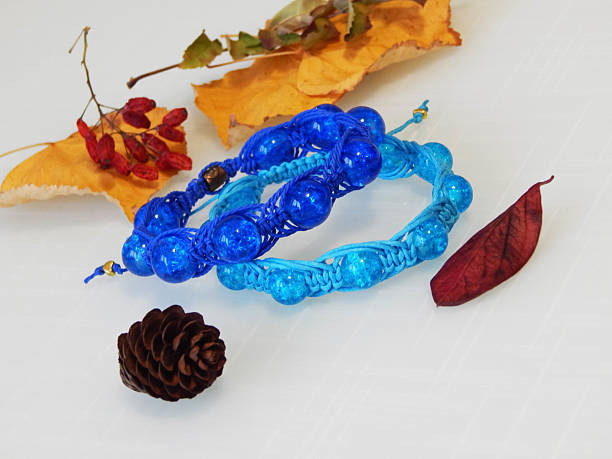 Rainbow bracelets in a creative workspace.