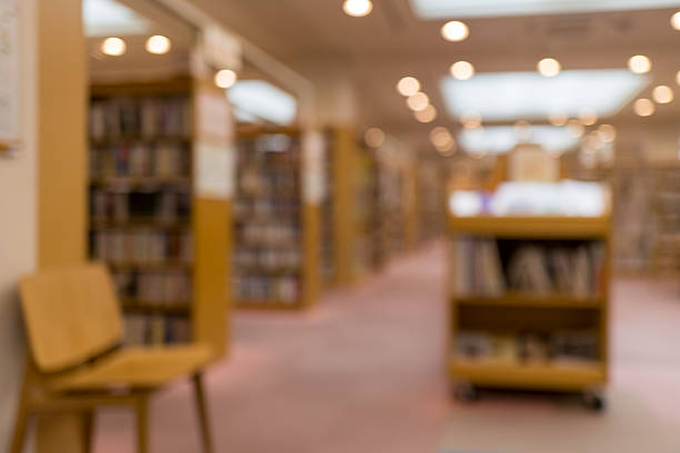 istock Quiet Library Aisle in Defocus、Blurred Bookshelves – Library Background 2224799147