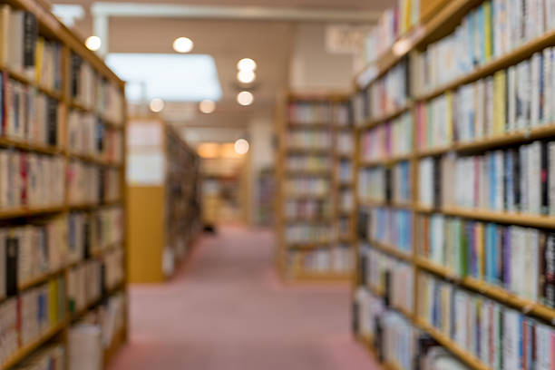 istock Quiet Library Aisle in Defocus、Blurred Bookshelves – Library Background 2224799153