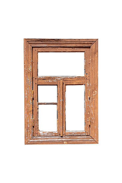 istock Old wooden window frame with worn brown paint is isolated. 2224800480