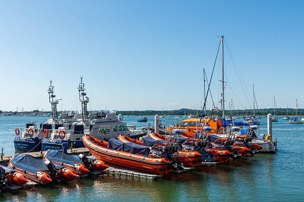 Poole Harbour, Poole, UK - July 12th 2025: Training boats and lifeboats moored at the RNLI College.