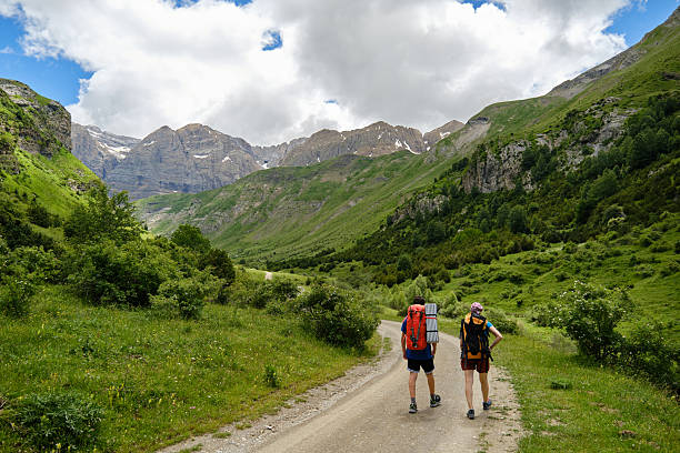 istock Hikers with backpacks on a mountain trail 2224811196