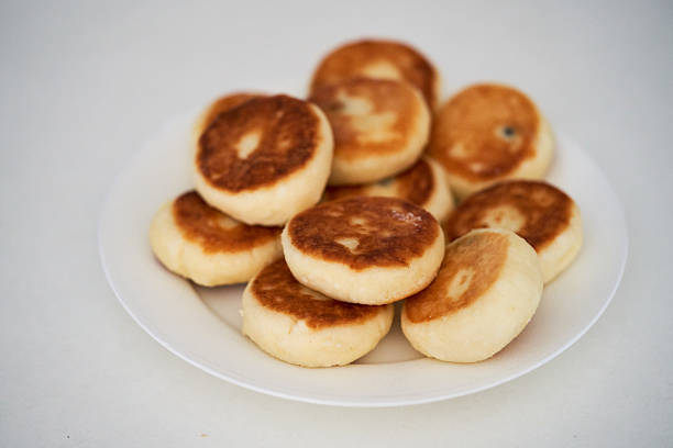 syrniki are lying on a white plate