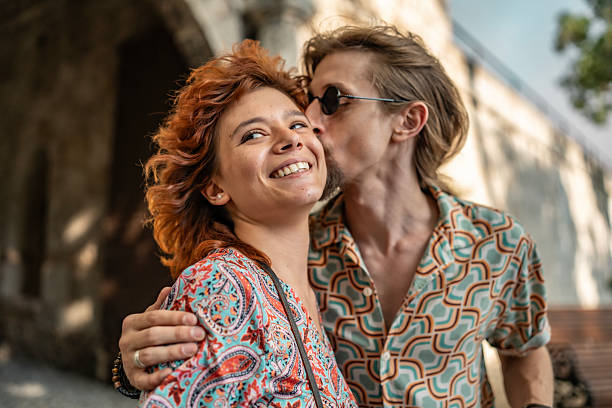 Faces. Fashion portrait of beautiful redhead couple isolated on grey studio background. Concept of male beauty, skin care, fashion and style. Artwork, modern and trendy portrait. Attractive models.