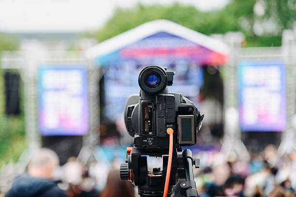 istock large black video camera on tripod outdoors 2224820341