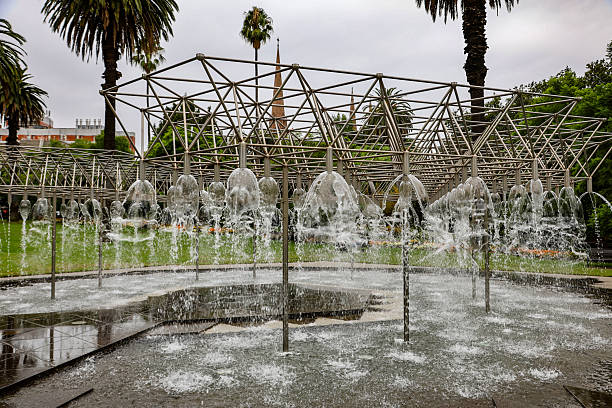 View of Coles Fountain, a stainless steel tubing structure, in Parliament Gardens, Melbourne, Victoria, Australia