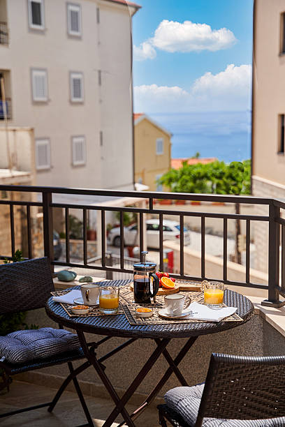 istock Seaside balcony breakfast with coffee and juice overlooking ocean view 2224824076