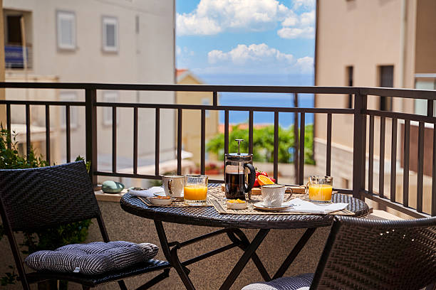 istock Scenic breakfast on balcony overlooking ocean view with coffee and fresh juices 2224824077