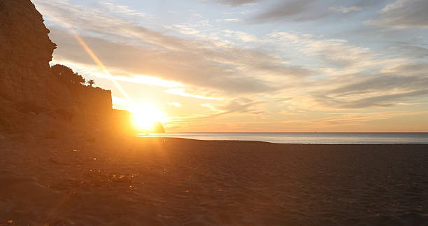 istock Sunrise over ocean, beach and cliffs at sunrise 2224828219