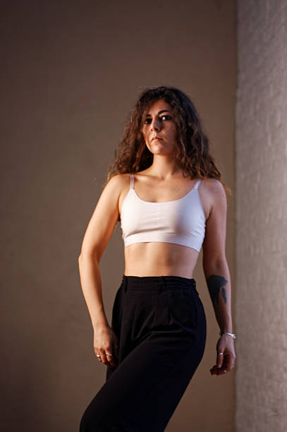 istock A young woman in white bra and black pants 2224832262