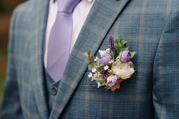 istock purple boutonniere on groom jacket 2224833443