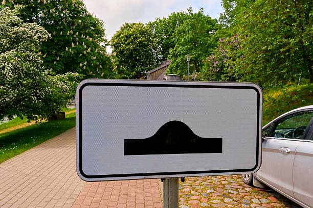 Main road traffic sign in the countryside in summer.