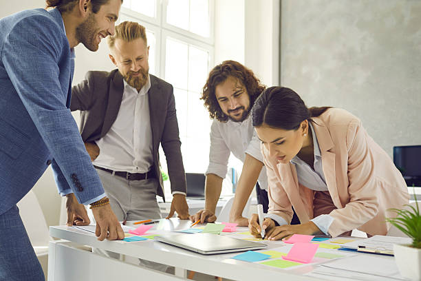 istock Diverse employees engaged in creative thinking in office 2224844608