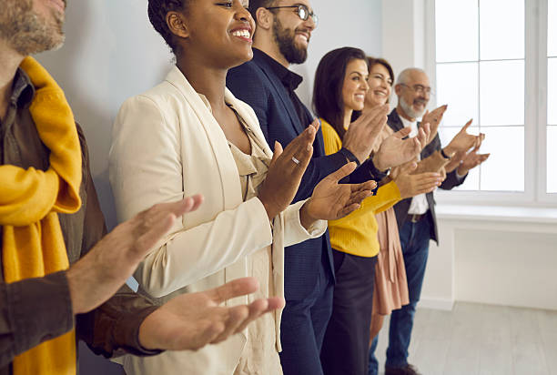 istock Happy diverse employees clap hands show acknowledgement 2224845014