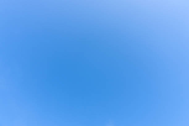 Low angle view and full frame of beautiful light blue sky without clouds in the afternoon on sunny day is used as natural background texture in decorative art work.