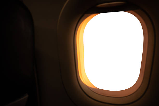 White screen mockup through window of wing of plane.