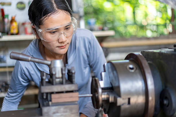 istock Skilled Asian Woman Machinist Working on a Lathe Machine in a Workshop 2224851265