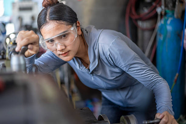 istock Skilled Asian Woman Machinist Working on a Lathe Machine in a Workshop 2224851379