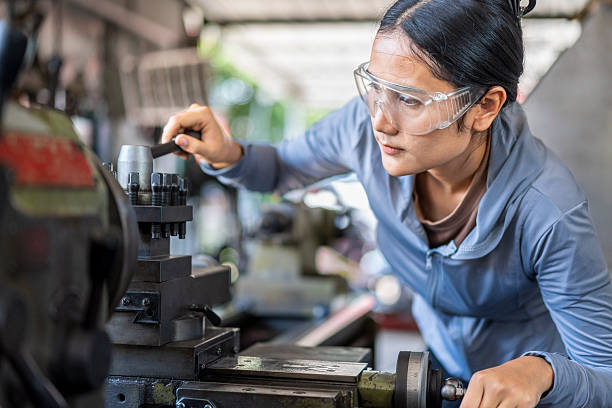 istock Skilled Asian Woman Machinist Working on a Lathe Machine in a Workshop 2224851419