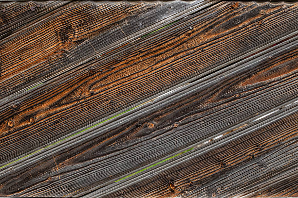 Old weathered wooden fence slats , sun burned surface, abstract  backdrop