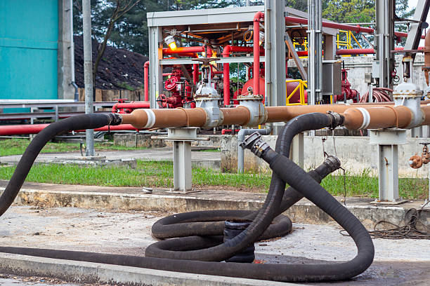 istock Industrial facility with pipelines and hoses for liquid transportation and storage operation in 2224853370