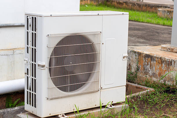 istock A white outdoor air conditioning unit stands outside a building providing efficient cooling for 2224853568