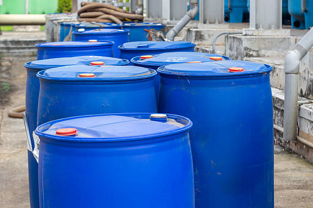 istock Blue plastic barrels stacked in an industrial setting representing storage or waste management 2224854008