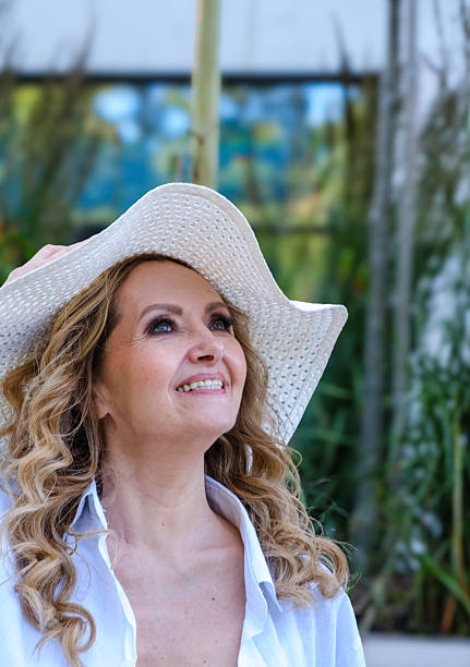 istock A woman wearing a white hat and a white shirt 2224856966