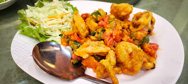 istock Squid stir-fried with salted eggs in a restaurant 2224862313