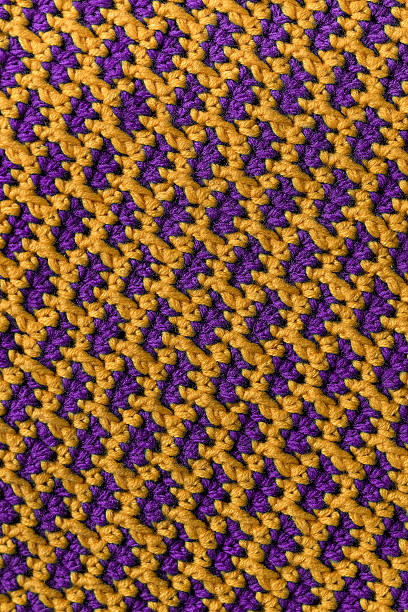 istock Bright knitted fabric texture. Crochet purple yellow brick pattern. 2224865276