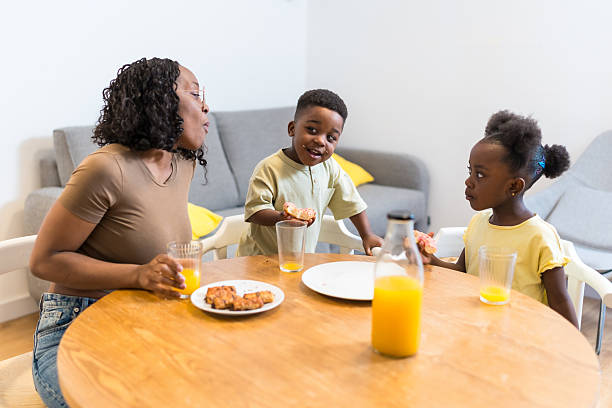istock Mother having breakfast with her two children at home 2224866851