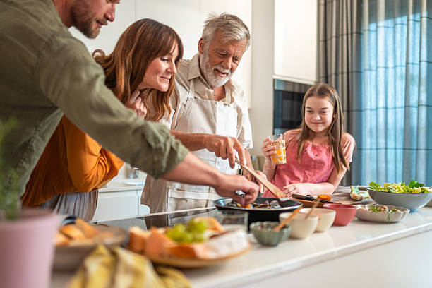 istock Caucasian Multigenerational Family Cooking Together in Bright Kitchen 2224869083