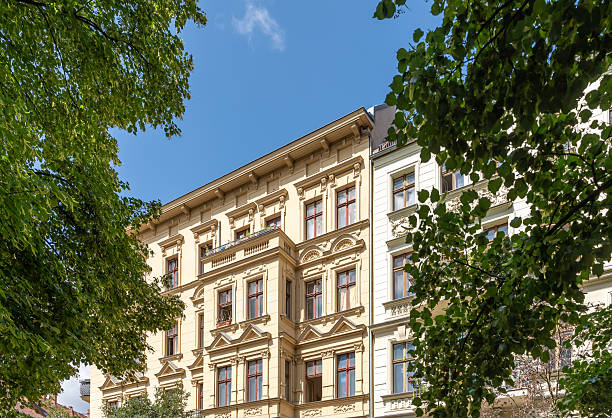 Germany, Berlin, Prenzlauer Berg, July 04, 2025 - Old houses between street trees