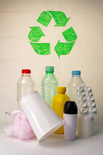 istock Plastic bottles, containers, and bubble pack ready for recycling with recycle symbol on the background 2224877350