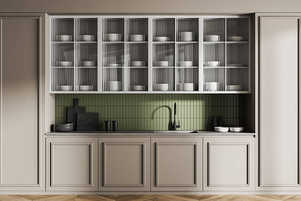 istock Modern kitchen interior with light cabinets, green tiled backsplash, and minimalist dishware arrangement on shelves. 3D Rendering concept visualization. 3D Rendering 2224877872