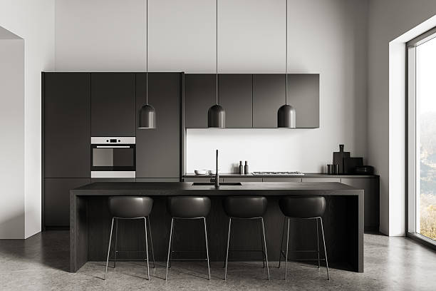 istock Modern minimalist kitchen interior concept featuring matte cabinetry, sleek island, and pendant lighting in neutral tones with natural daylight window. 3D Rendering 2224877970