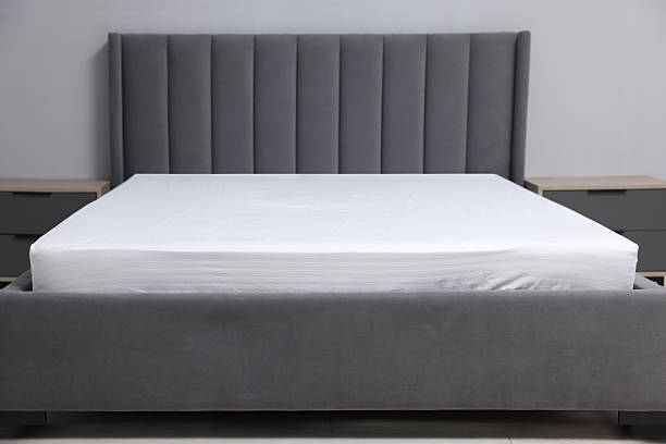 istock Comfortable bed with clean linens at home 2224878001