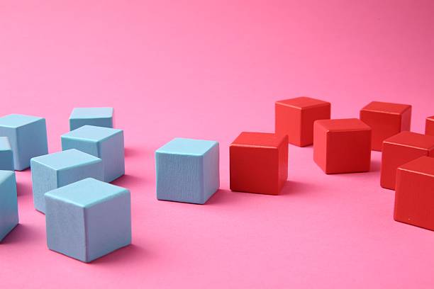 istock Many wooden colorful cubes on pink background 2224878063