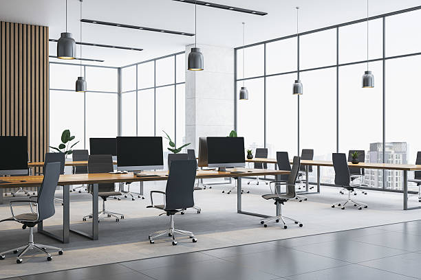 istock Modern empty open-space office interior with sleek desks, panoramic windows, and city view during daylight in a contemporary corporate building. 3D Rendering 2224880824