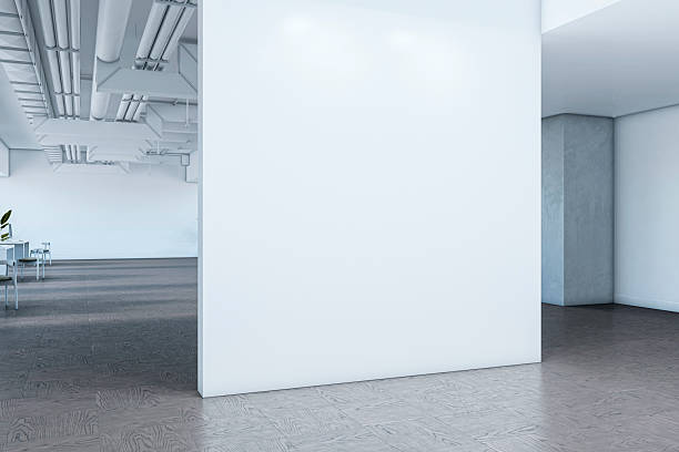istock Empty white wall in modern corporate office interior with clean design and dark wooden floor, perfect for branding or poster mockup display. 3D Rendering 2224880909