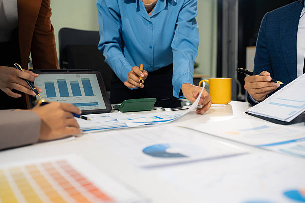 istock Businessmen team or financial data analysts working with tablets and laptop computers and data graphs together. Plan to analyzing projects in the office. 2224882499
