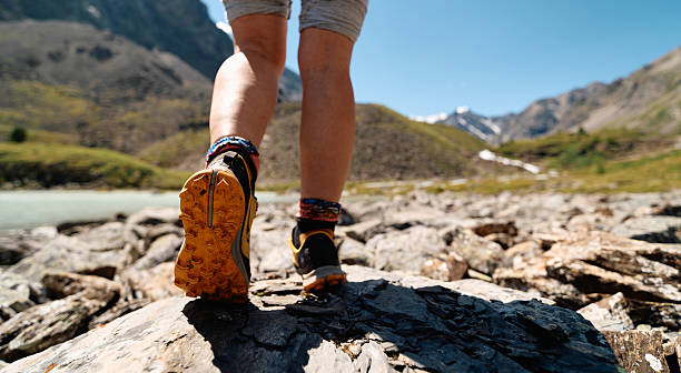 womens footsteps in the backcountry, backview