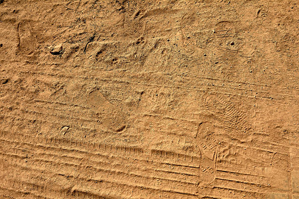 istock Textured ground with shoe impressions 2224885093