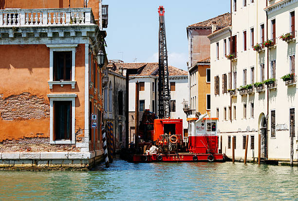 Venice, Italy - September 25, 2009: Big Blue Platform Dock and Large Crane in Shipyard at Industrial Zone Venezia.