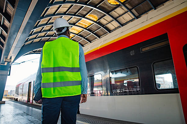 istock Engineer on the train station inspecting the train 2224887398